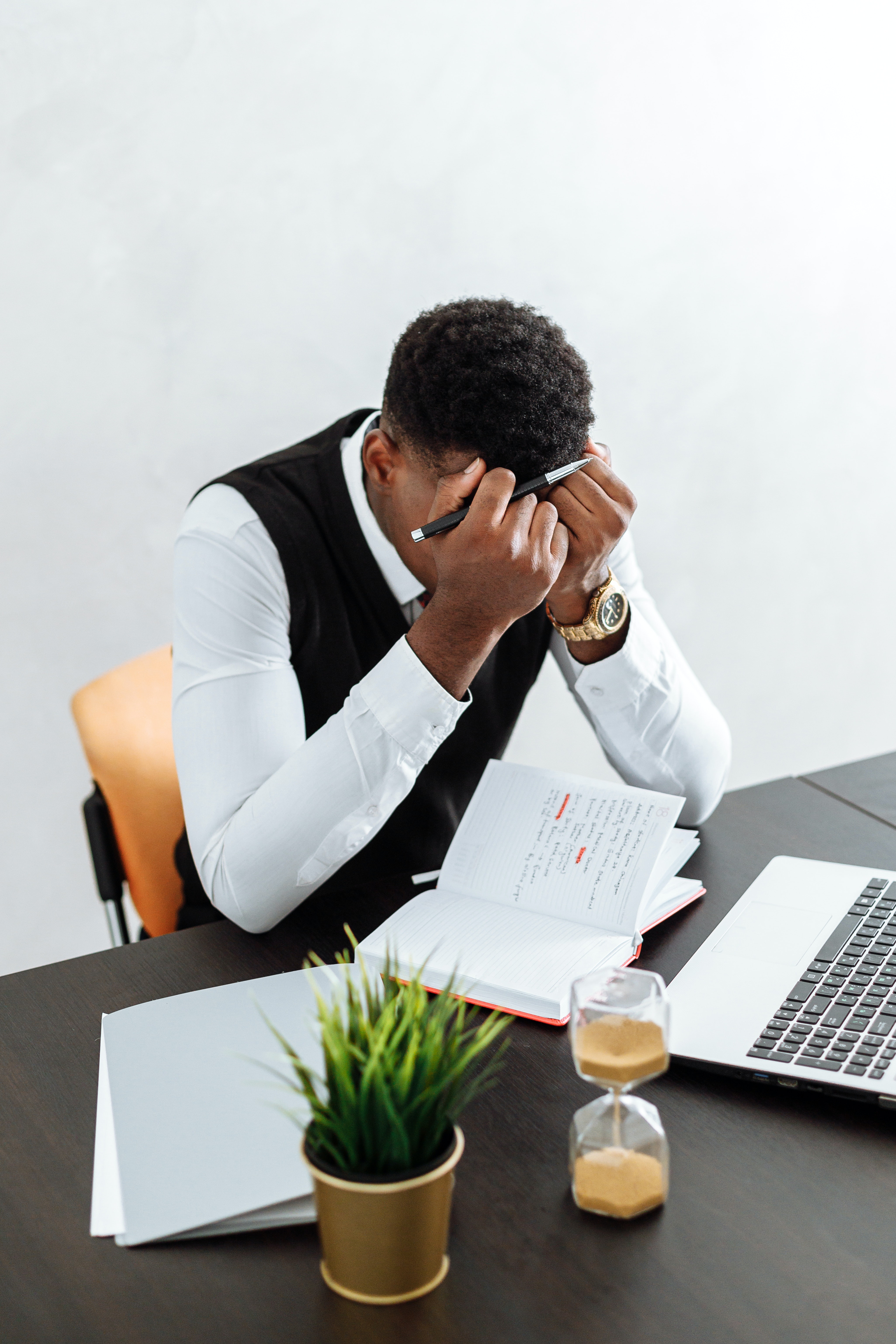 Man with his hands in his head feeling overwhelmed