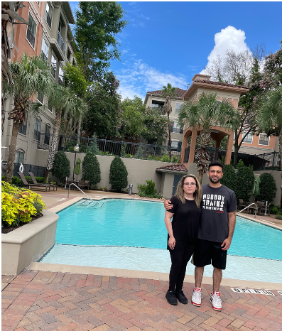 My sister & I in front of the pool at my new apartment.