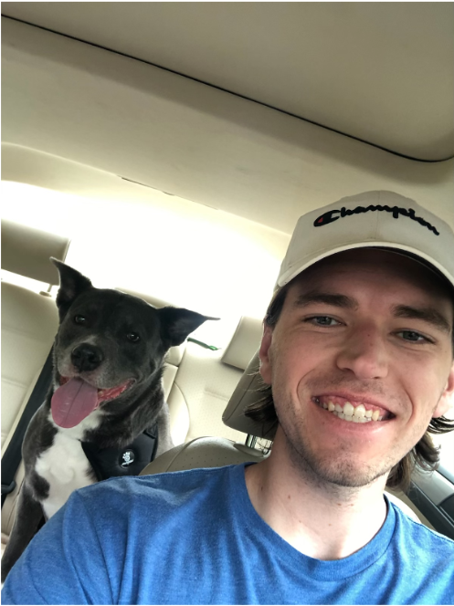 My best friend Brandon being extremely helpful by driving my dog Smokey from New York to Texas to stay with me.