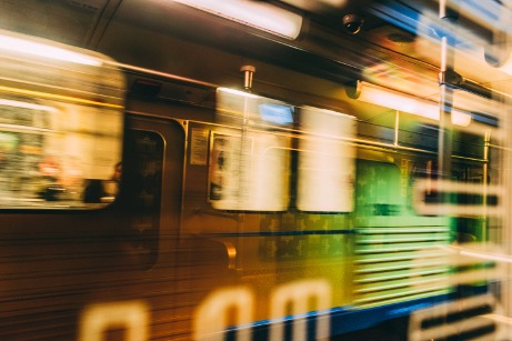 Blurred train traveling to a destination.